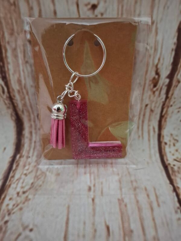 emballage-offrir-pompon-couleur-qualite-timaiika-l-lettre-alphabet-prenom-002 Accessoire unique en résine époxy, décoré de notes de musique scintillantes, idéal pour un cadeau ou un souvenir.